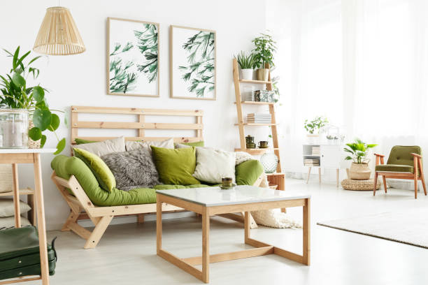 istock Natural apartment with green couch 907742230