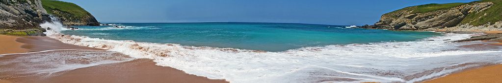 Wave on the beach in sunny day.  Panoramic photo