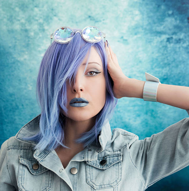 istock Young woman with blue hair 907747088