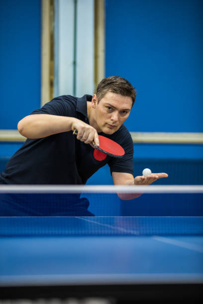 istock Mature man serving in table tennis 907747526