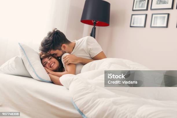 Waking Up Stock Photo - Download Image Now - Bed - Furniture, Couple - Relationship, Embracing