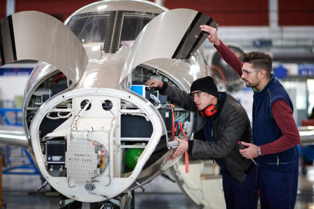 istock Aircraft mechanics in the hangar 907752874