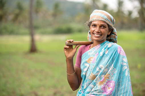 Indian farmer women on farm field with happy face, Tamil nadu, India.
