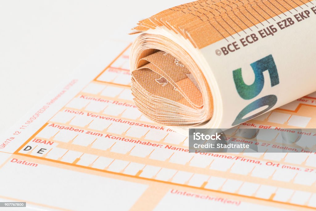 A form for a bank transfer and euro banknotes Bank Deposit Slip Stock Photo