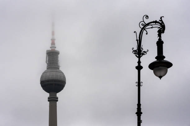 old and new berlin - tv tower and a street lamp in fog - berlin radio tower imagens e fotografias de stock