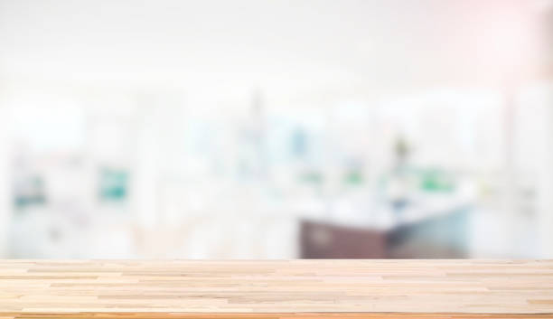 istock Wooden worktop on blur background 907769248
