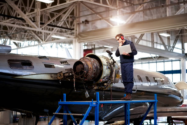istock Aircraft mechanic in the hangar 907769900