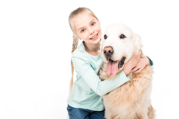 istock adorable child with dog 907779098