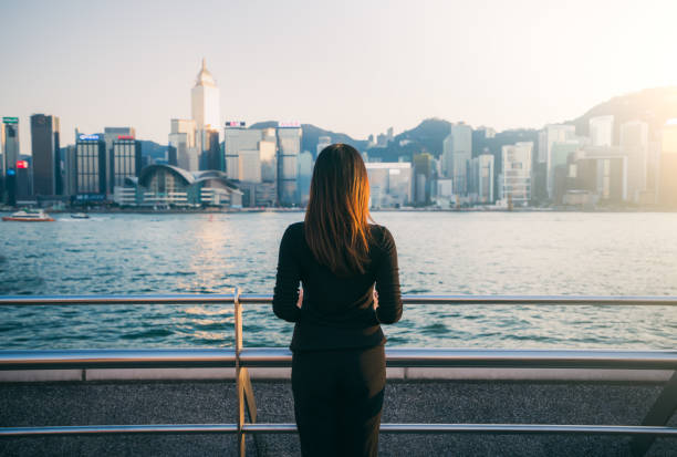 istock Young woman enjoying the cityscape 907787992