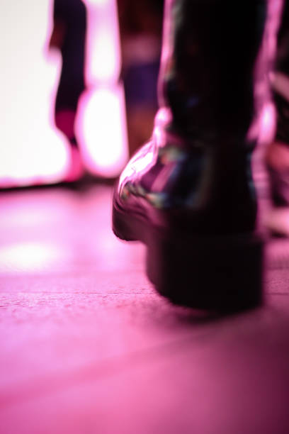 istock urban illuminated floor with shoes 907801120
