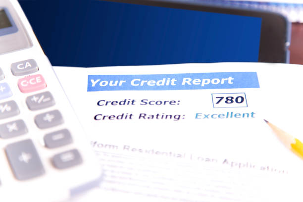 istock Credit report, score, loan documents, digital tablet, and calculator on desk. 907811434
