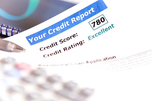 istock Credit report, score, loan documents and calculator on desk. 907816914