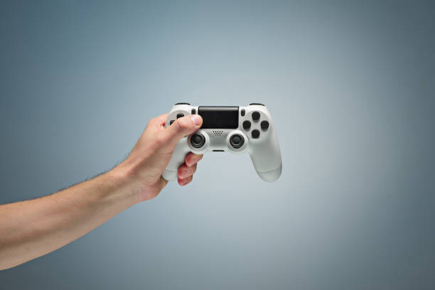 male hands holding gamepad - joystick gamepad control joypad imagens e fotografias de stock