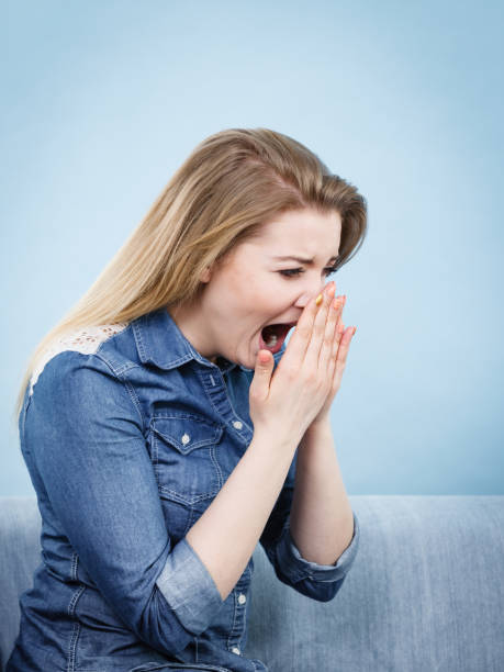 istock Sad screaming woman holding her nose 907819876