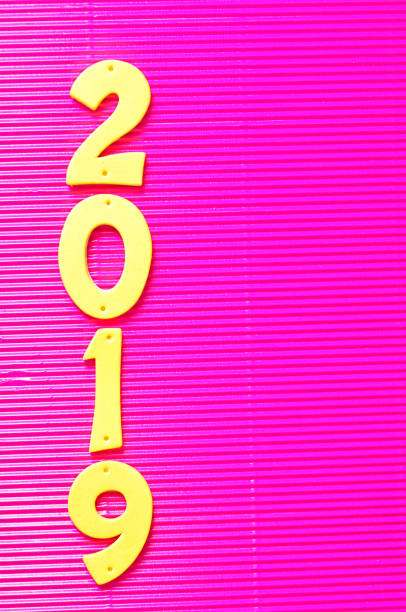 istock 2019 in yellow numbers on a pink background 907821798