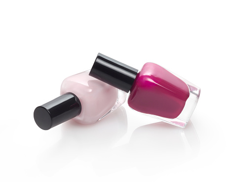 Two nail polish bottles,red and pink color against white background and a soft shadow. Clipping path