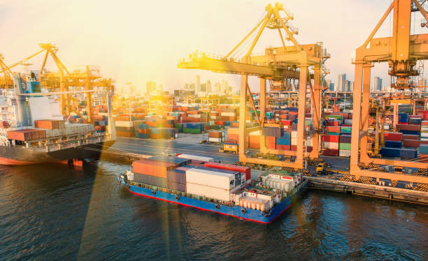 istock container,container ship in import export and business logistic,By crane,Trade Port , Shipping,cargo to harbor.Aerial view,Water transport,International,Shell Marine,transportation,logistic,trade,port 907834218