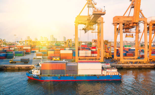 istock container,container ship in import export and business logistic,By crane,Trade Port , Shipping,cargo to harbor.Aerial view,Water transport,International,Shell Marine,transportation,logistic,trade,port 907834222