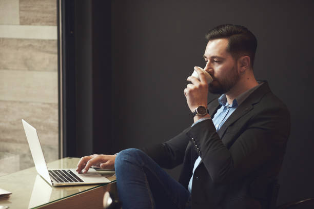 istock Businessman sitting in cafe. 907834890