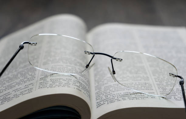 istock Cyrillic Holy bible with glasses 907835020