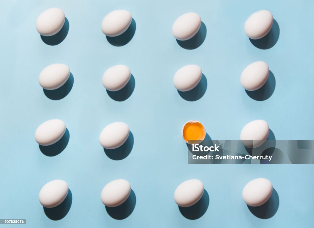 Organic white eggs on blue. Abstract pattern. Eggs in isometric. Organic white eggs on blue background. Abstract pattern. Eggs in isometric. Animal Egg Stock Photo