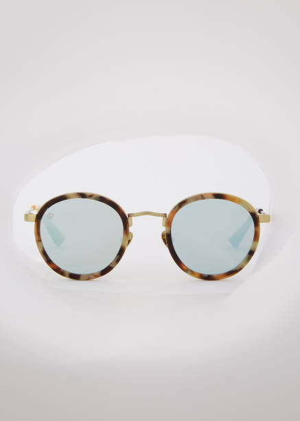 istock unglasses with glass mirrors isolated on light background with summer 907838204