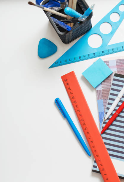 istock Collection of school supplies on white background 907838400
