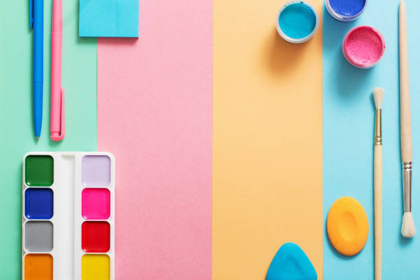 istock school supplies at  colorful paper background texture 907838416