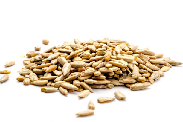 istock Sunflower Seeds Isolated on White Background 907843444