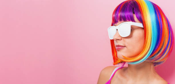 istock Beautiful woman in a colorful wig 907844536