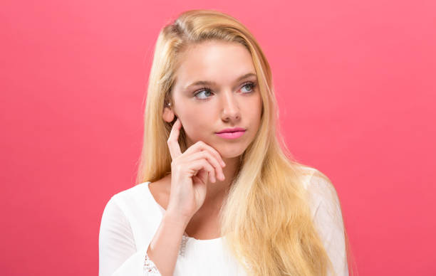 istock Young woman in a thoughtful pose 907844676