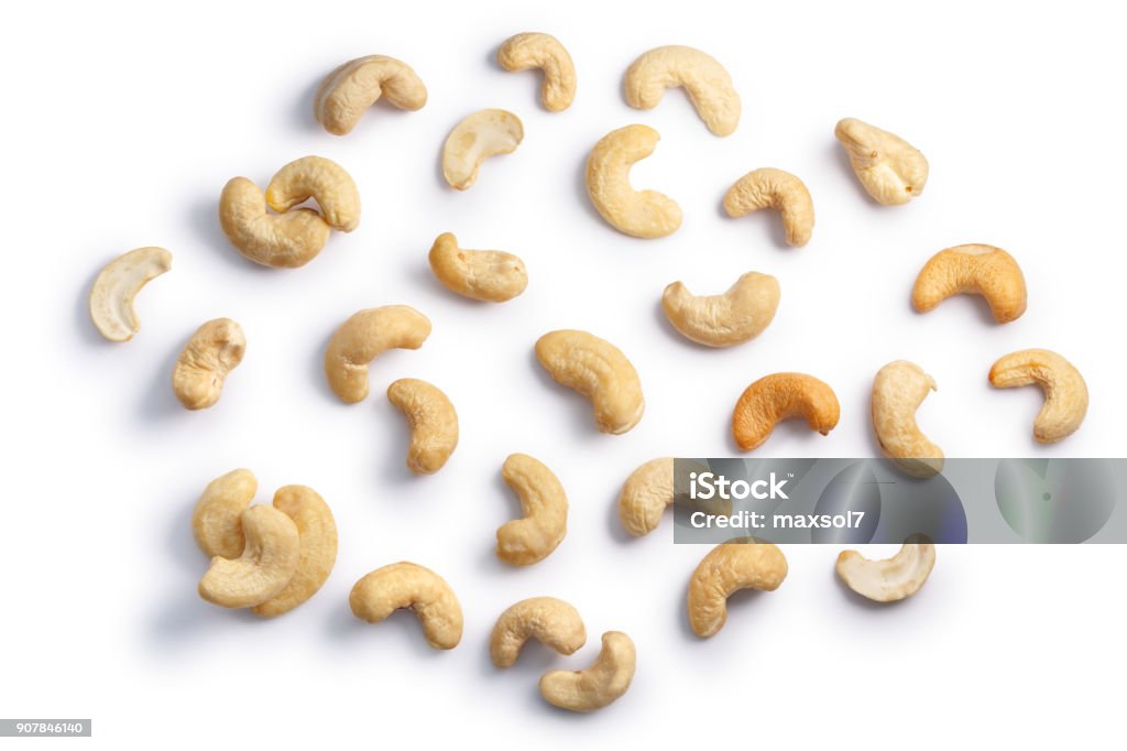 Cashews seeds of A. occidentale, top, paths Cashew nuts (seeds of Anacardium occidentale), shelled, top view. Clipping paths, shadows separated Cashew Stock Photo