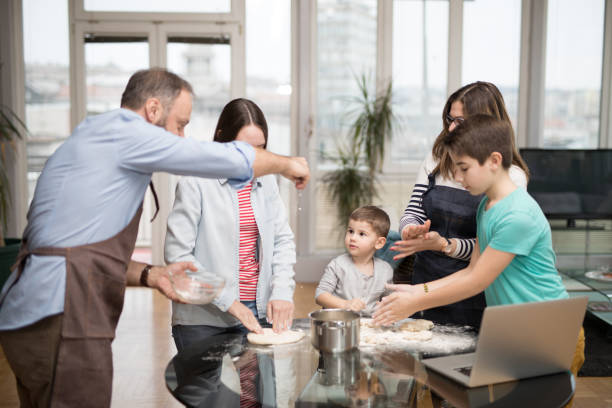 istock Young family making pastry at home 907846348