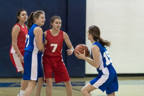 istock Girls high school basketball game 907848196