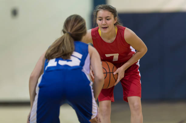 istock Action-Packed Girl's High School Basketball Game 907848208