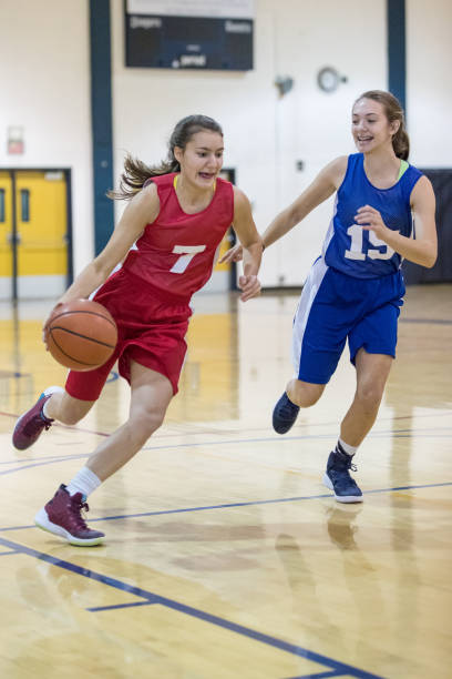 istock Girls high school basketball game 907848228