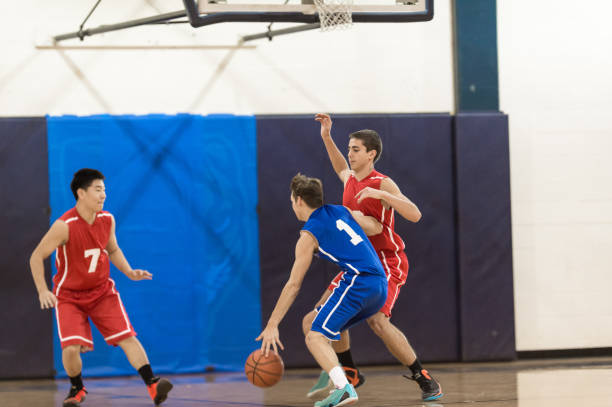 istock Boys high school basketball game 907848238