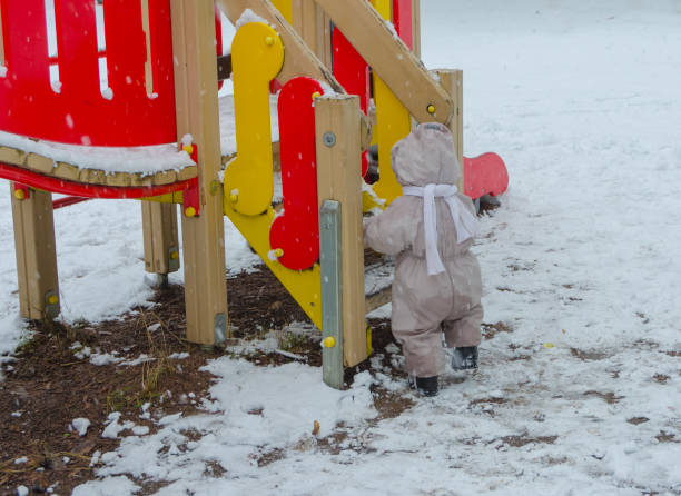 istock winter in the Park with slide, child 907850172