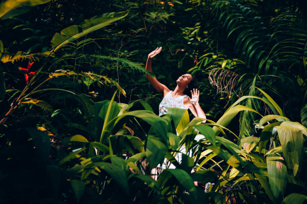 Young Brazilian woman dancing in the forest