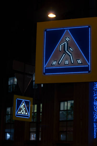 istock Two illuminated road sign pedestrian crossing 907850624