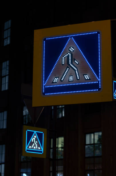 istock Two illuminated road sign pedestrian crossing 907850650