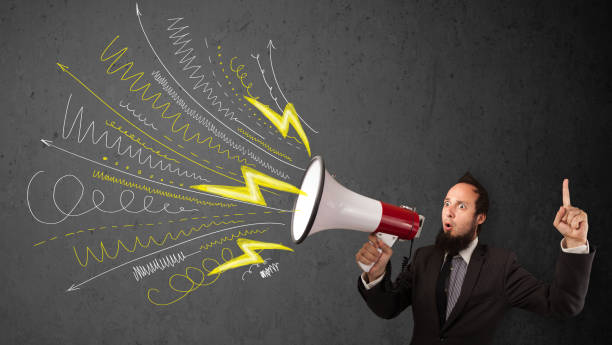 istock Leader guy shouting into megaphone with hand drawn lines and arrows 907850880