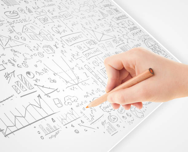 Human hand sketching ideas on a white paper Human hand sketching multiple ideas on a paper escribir stock pictures, royalty-free photos & images