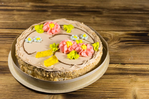 istock Cardboard box with Kiev cake with cream, nuts and meringue 907851692