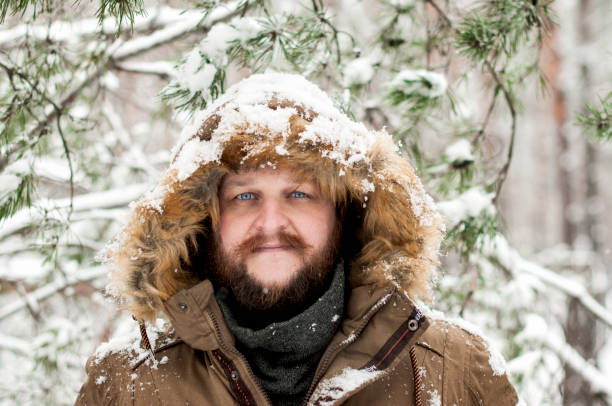 istock A man with a beard and mustache on a snowy forest 907852184