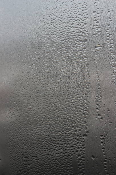 istock Water droplets on a window abstract photo 907852320