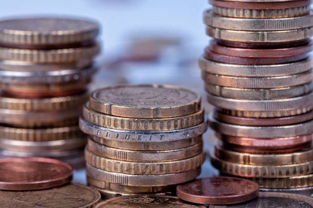 istock Many euro coins stacked in columns 907853064