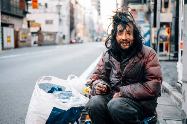 Homeless Man in Tokyo Japan A Japanese homeless man living on the streets of Tokyo, Japan. homeless person stock pictures, royalty-free photos & images