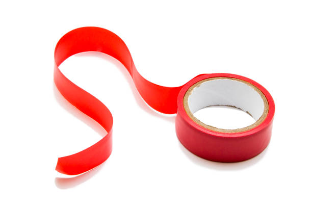 istock Red adhesive tape isolated on white background 907853646