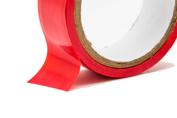 istock Red adhesive tape isolated on white background 907853762